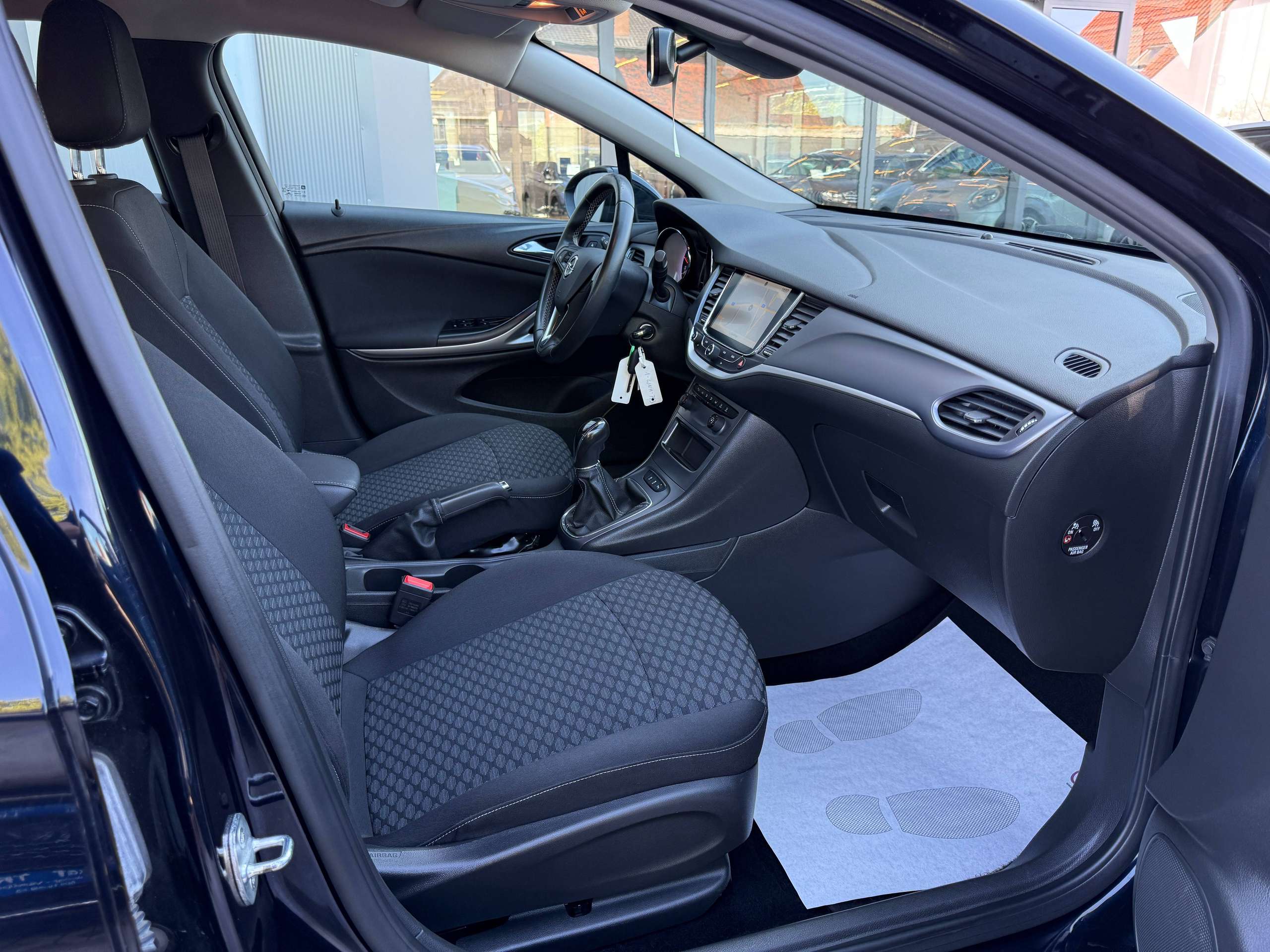 dd787c73-4d68-4092-9956-29271c608b1224-opel-astra-1-0i-105pk-tourer-navigatie-carplay-pdc-bluetooth-alu-carpass.jpg