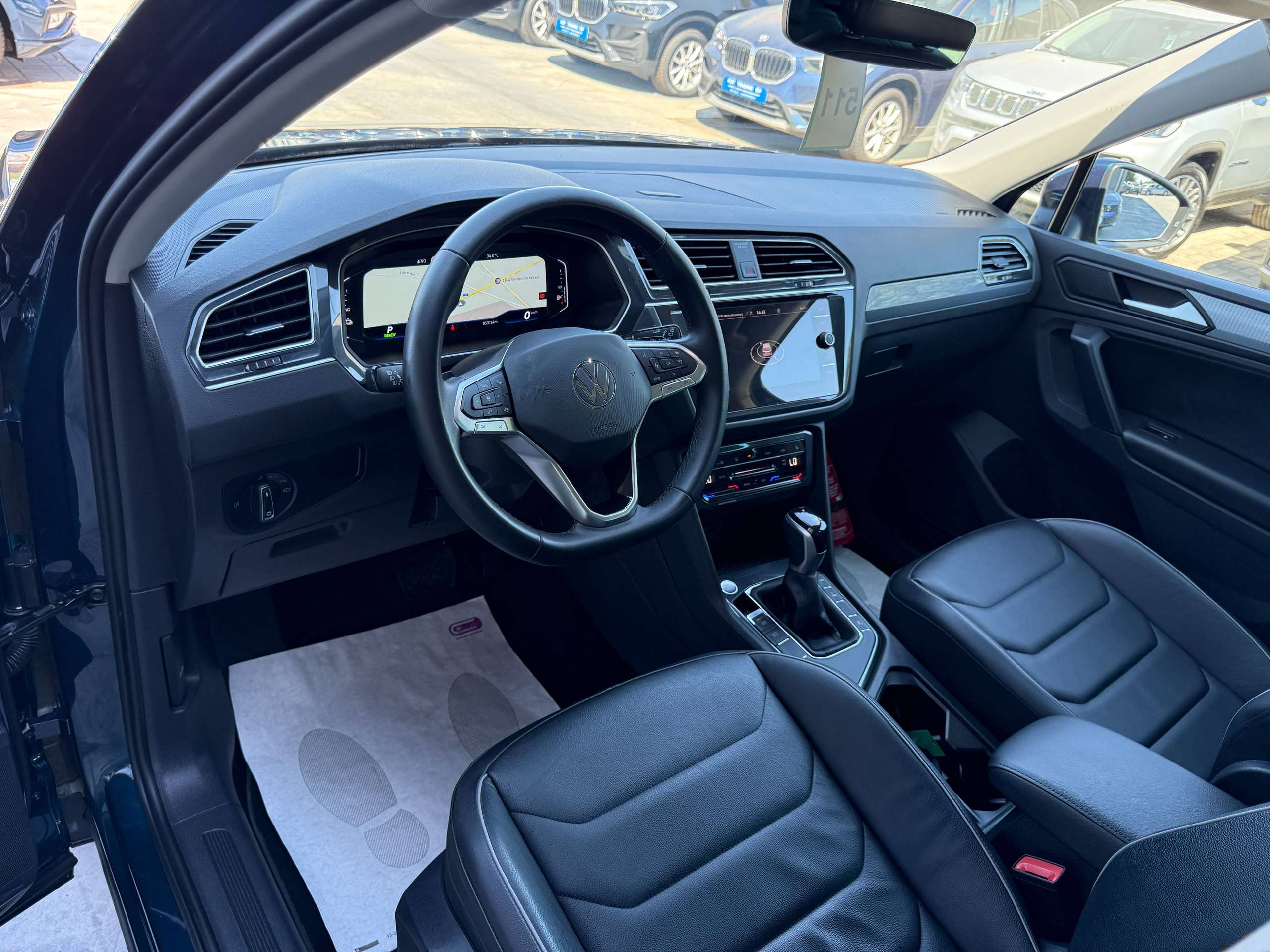564f47de-299f-48ef-8c06-172e04f8db7413-volkswagen-tiguan-1-4i-e-hybrid-automaat-navigatie-full-led-zwart-leder-360-camera-carplay.jpg